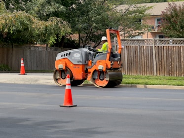 a man on a street working on a road