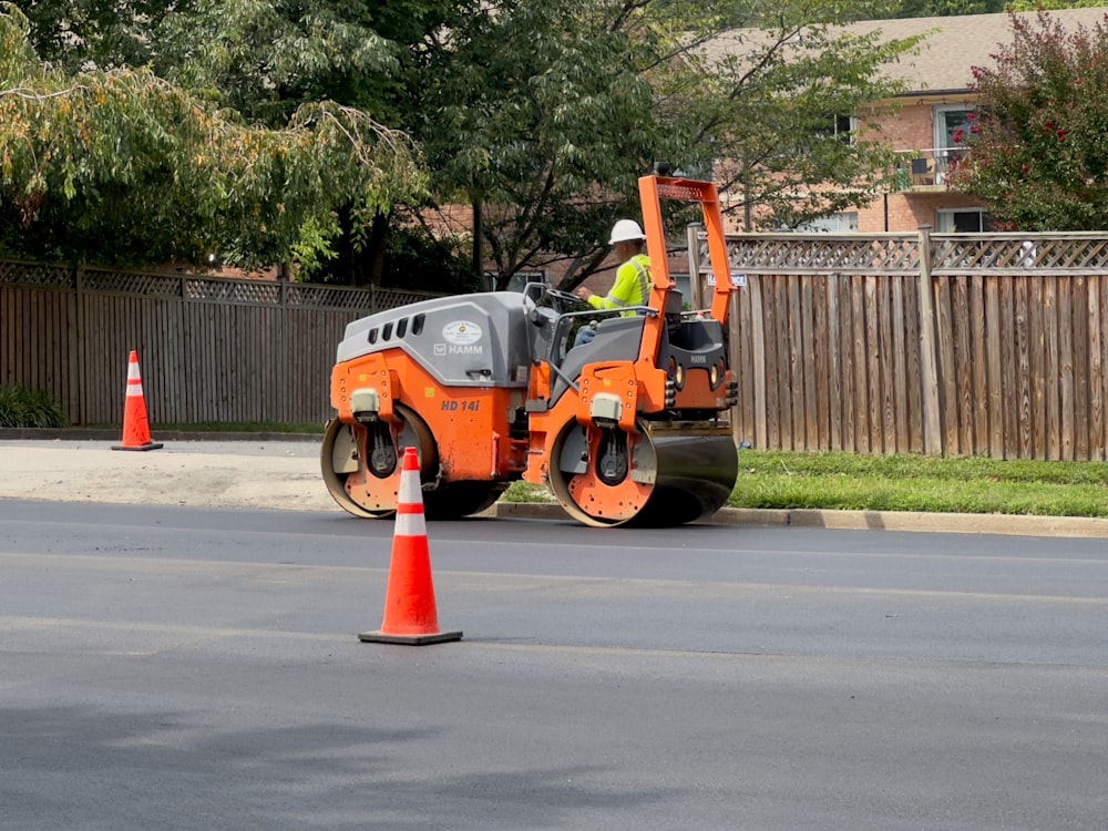 a man on a street working on a road