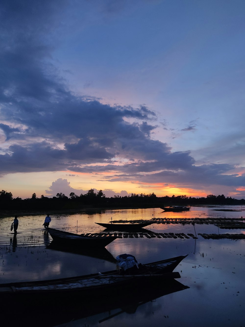 a couple of boats that are sitting in the water