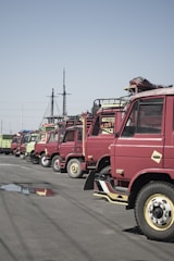 Fleet of water tanker trucks lined up ready for delivery.