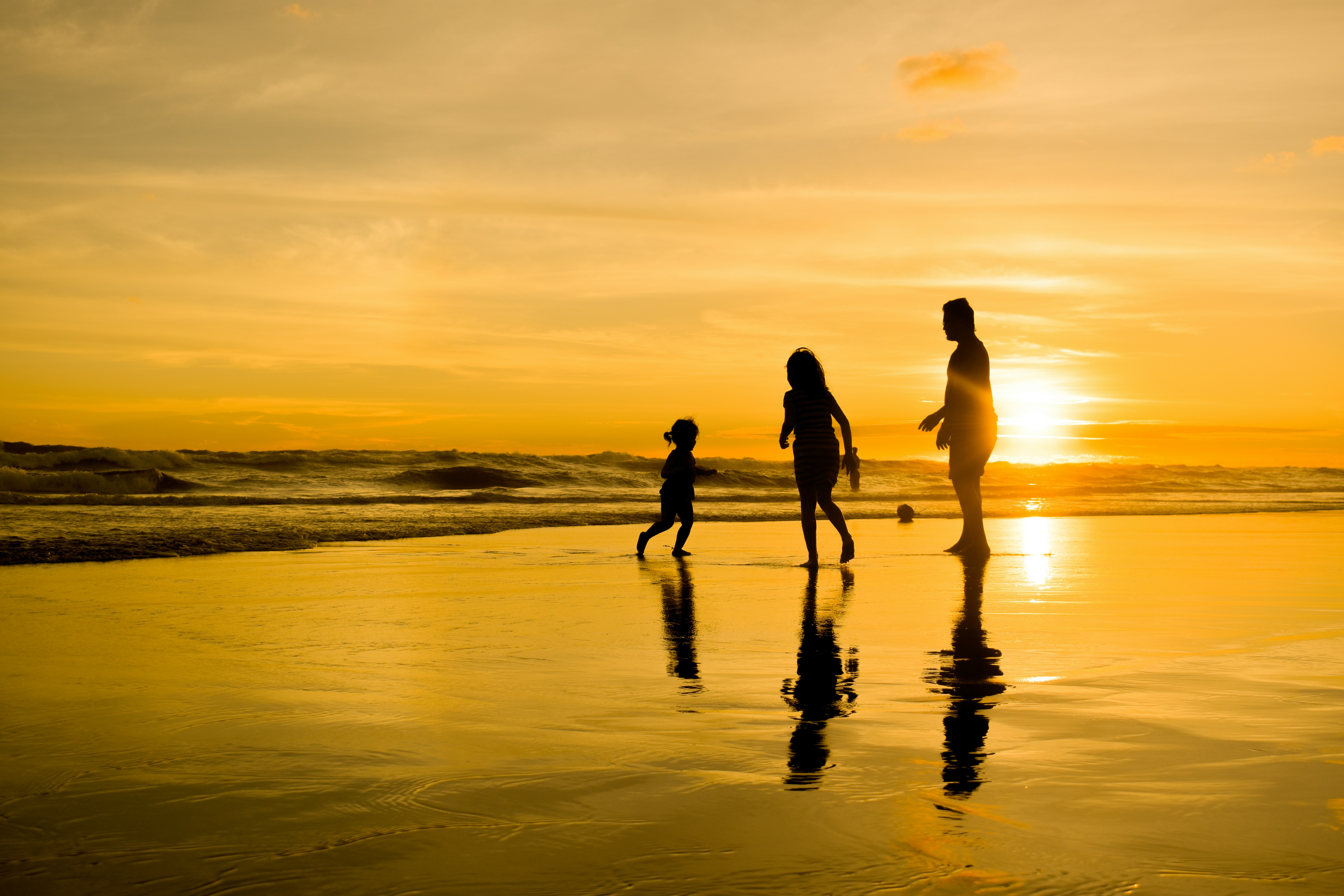 Family enjoying sunset on Panama City Beach - panama city beach vacation rentals​