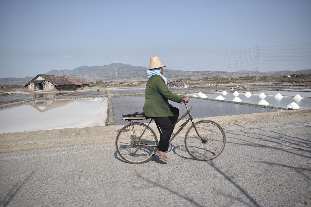 a person riding a bike on a road