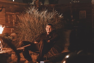 Outdoor heated chair pad glowing warmly on a chilly evening porch.