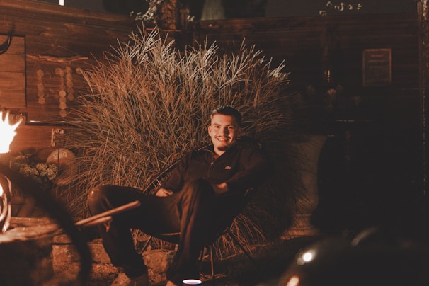 Outdoor heated chair pad glowing warmly on a chilly evening porch.