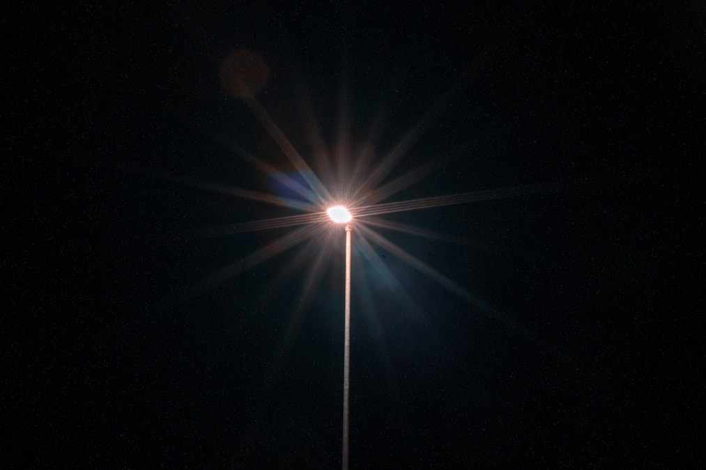 Street light illuminating a residential neighborhood at night, representing safety and security near Baylor University