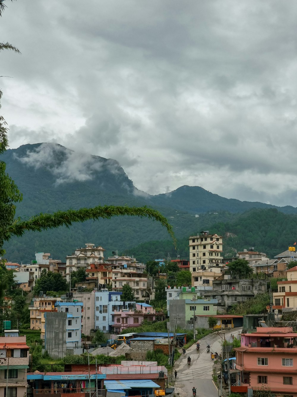 a view of a city with mountains in the background