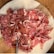 A vibrant display of assorted meats arranged neatly on a wooden cutting board.