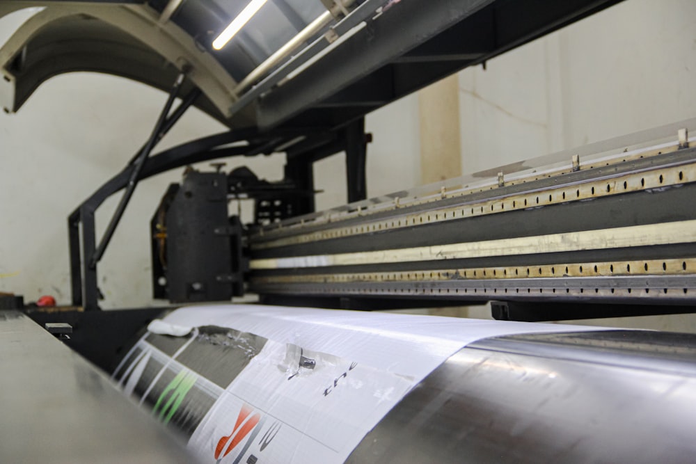 a machine that is cutting a sheet of paper