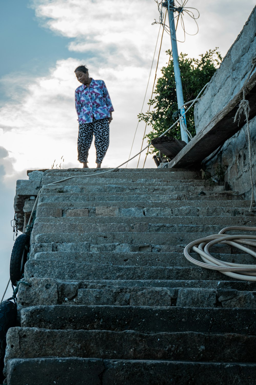 a man standing on top of a set of stairs