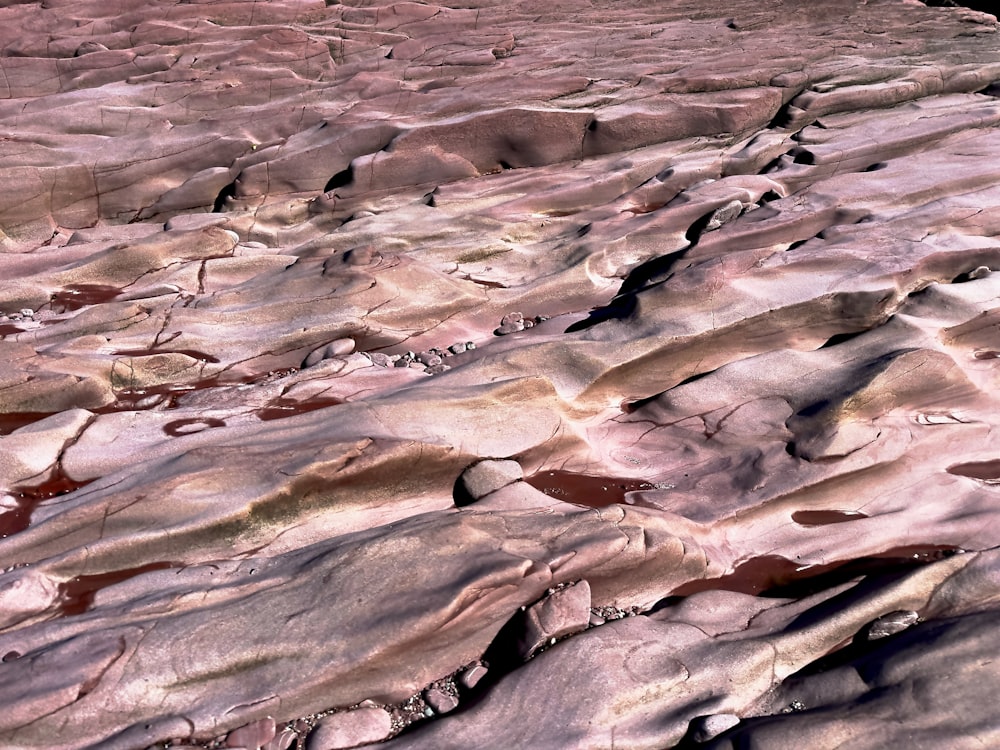 an aerial view of a rocky landscape with red rocks