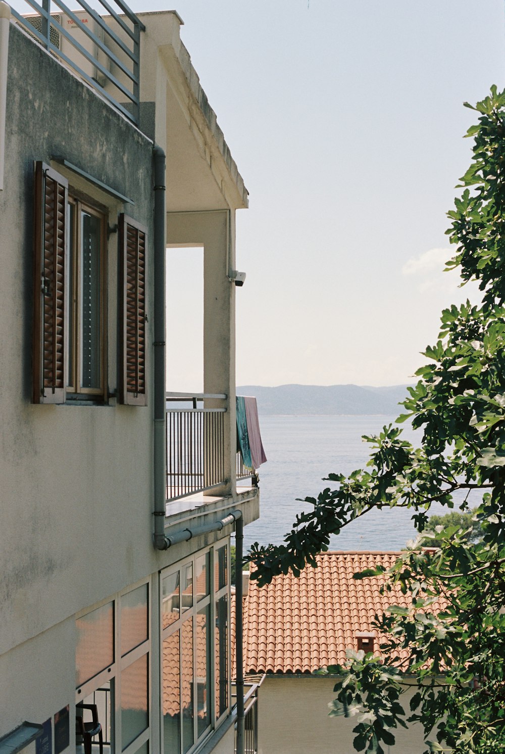 a balcony with a view of a body of water