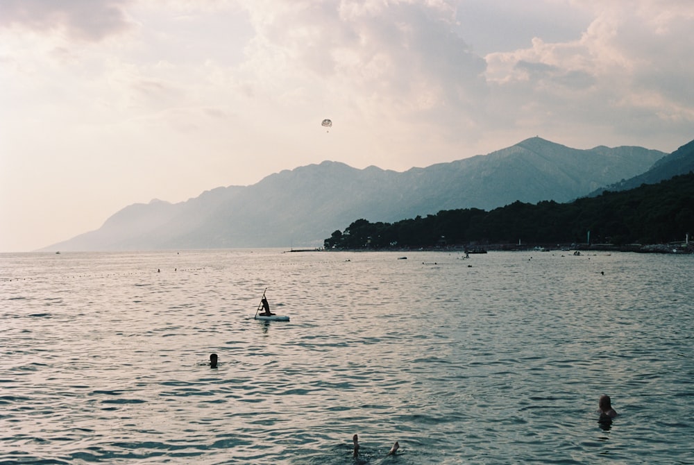 a body of water with a bunch of people in it