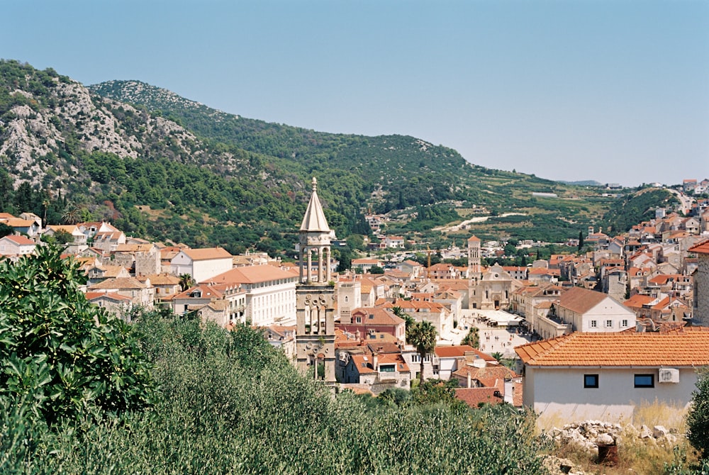 a view of a city with a steeple in the background