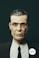 a man in a suit and tie with a sticker on his face