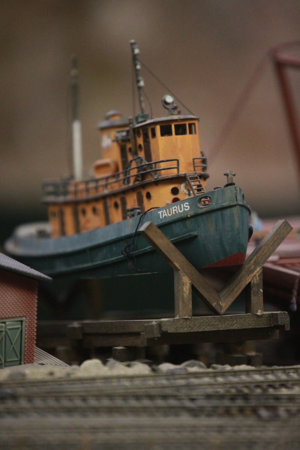 a model of a tug boat on a train track