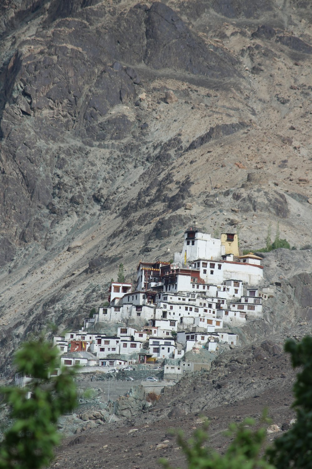 a very tall white building sitting on top of a mountain