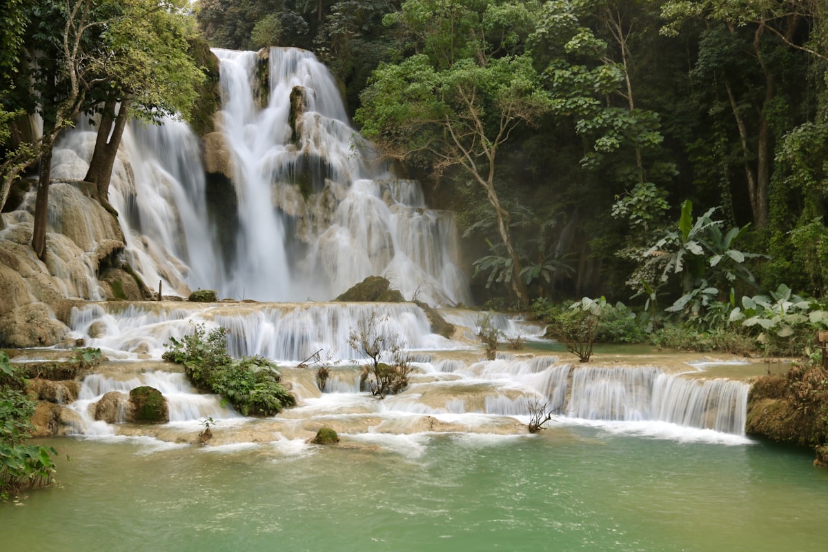 Luang Prabang October — Kuang Si waterfalls returning to turquoise as rains ease for Boun Ok Phansa
