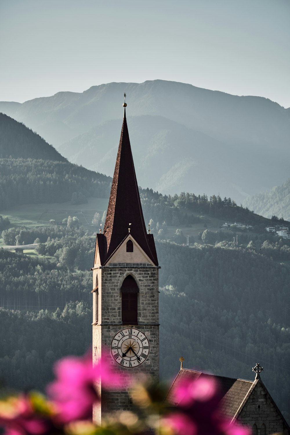 a church steeple with a clock on it