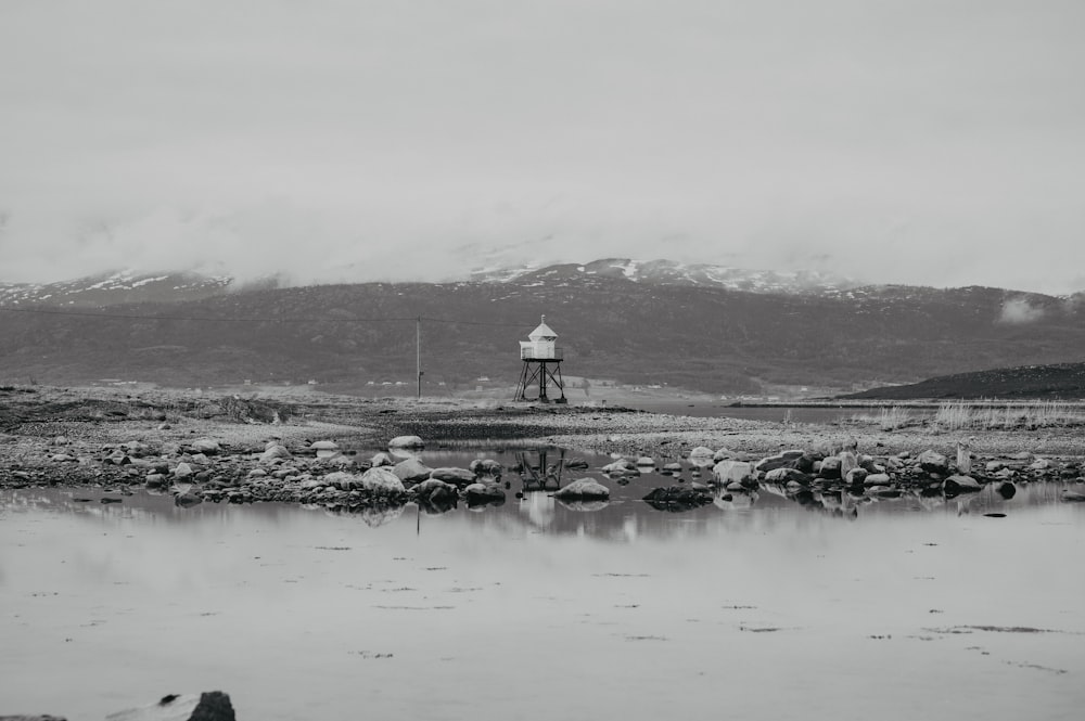 a black and white photo of a water tower