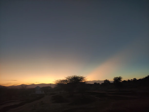 Sunset view over the peaceful natural landscape surrounding Mila House.