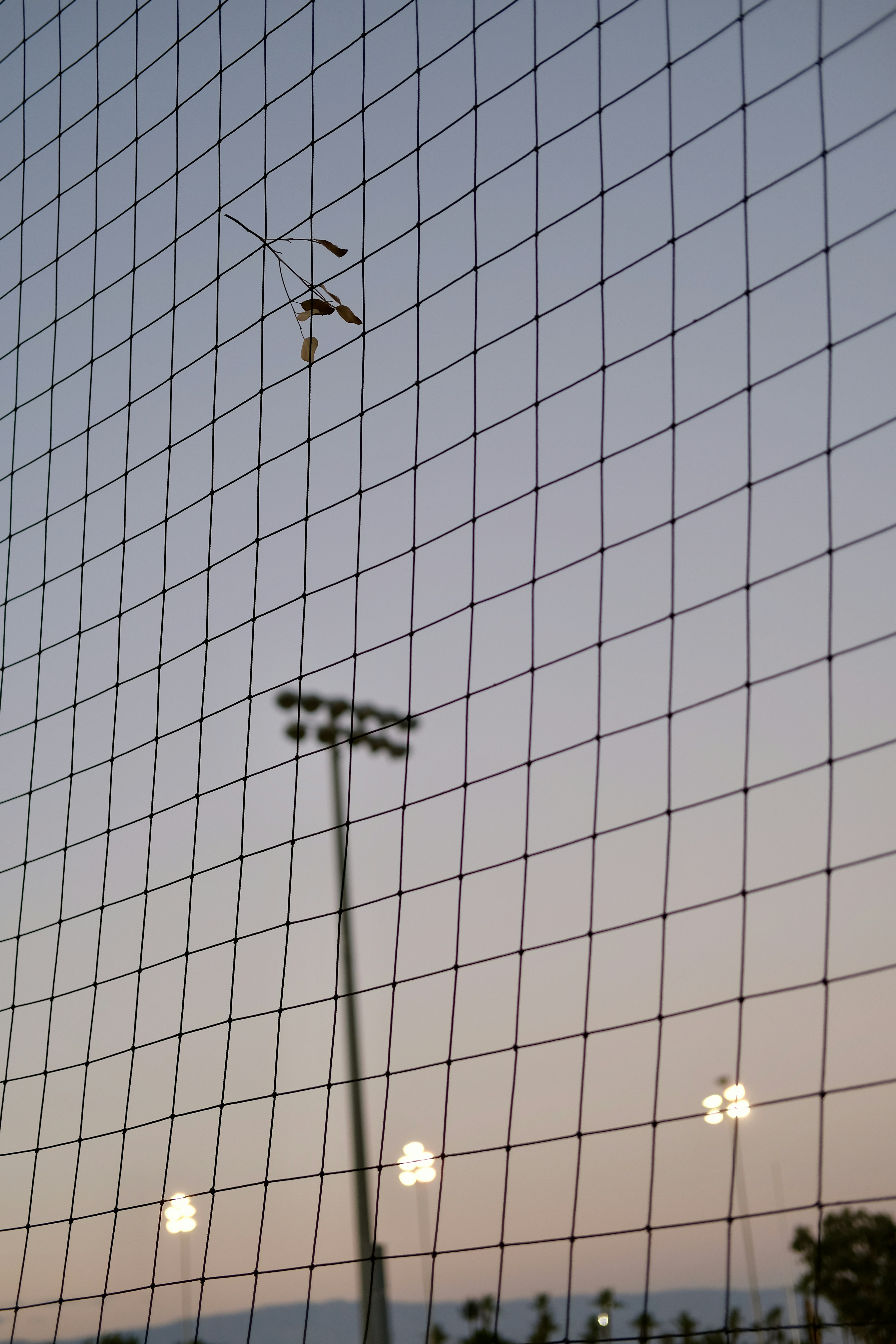 a view of a baseball field through a fence