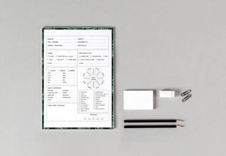 Close-up of quality control checklist with a pen on a white table.