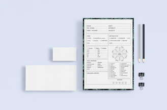 Stationery set with blue and white minimalist branding elements