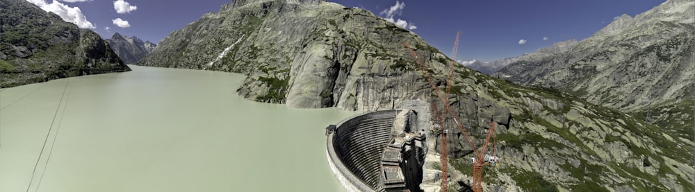 an aerial view of a dam in the mountains