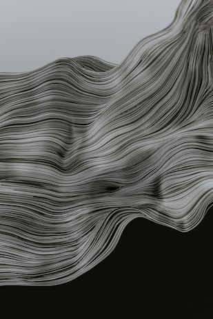An artistic representation of flowing wave-like elements suggesting natural craftsmanship.