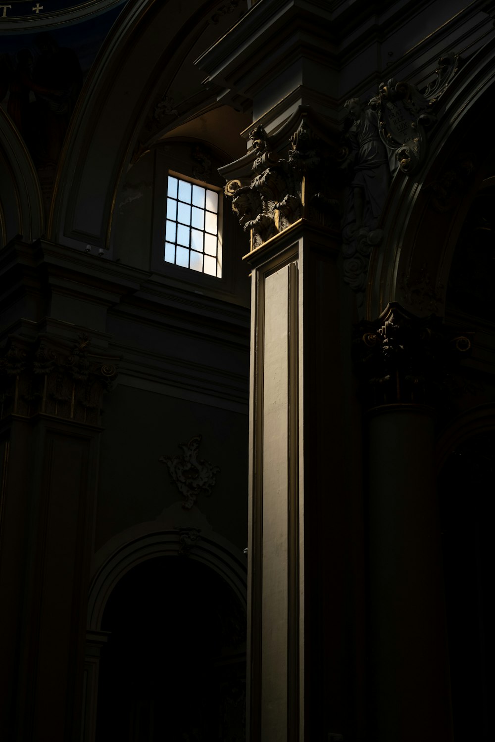 a tall clock tower in a dark room