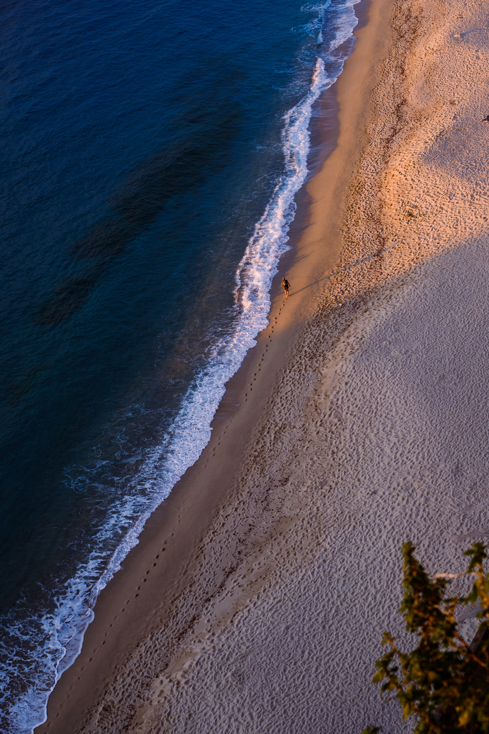 an aerial view of a beach and ocean