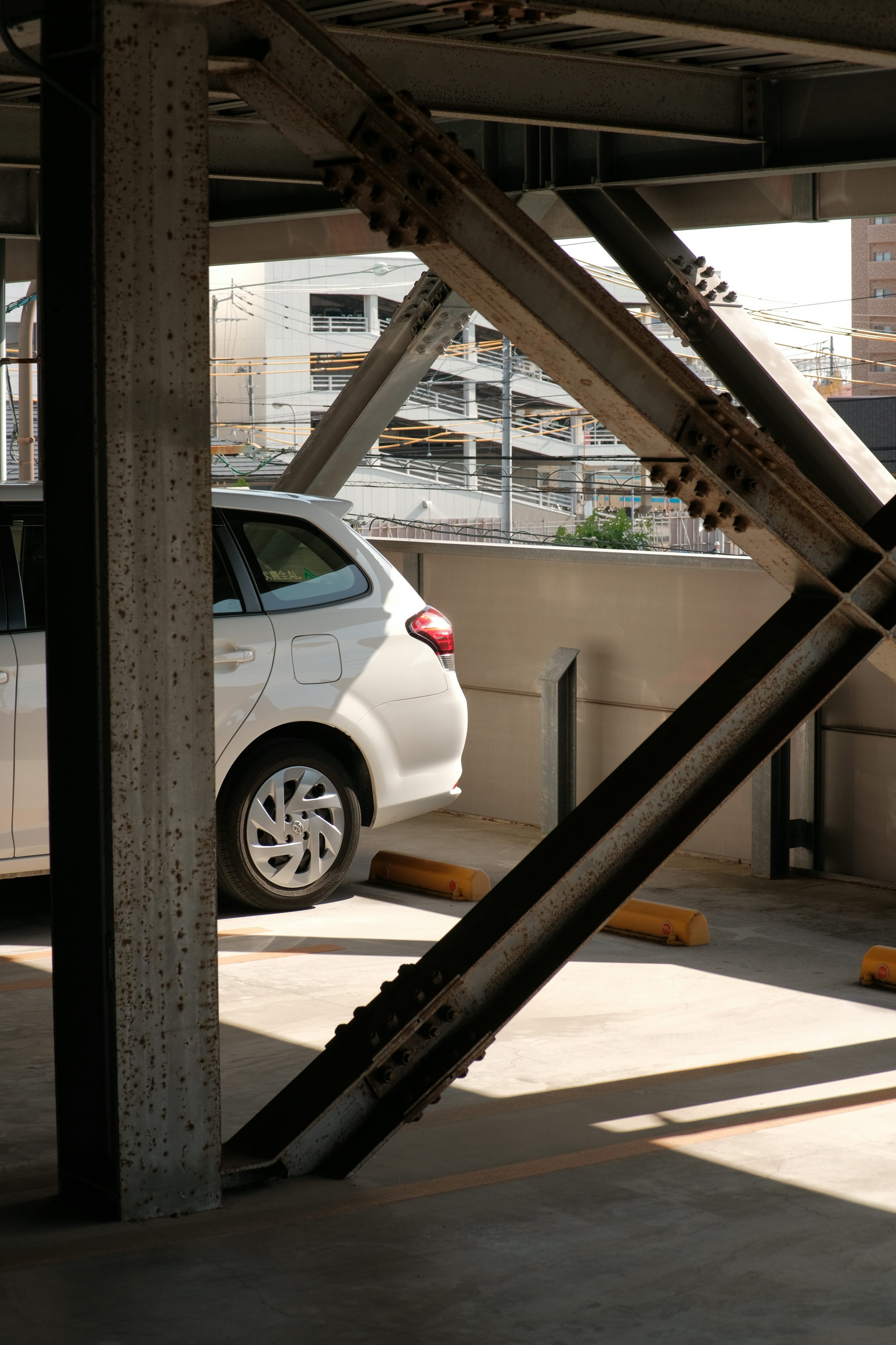 a white car parked in a parking garage