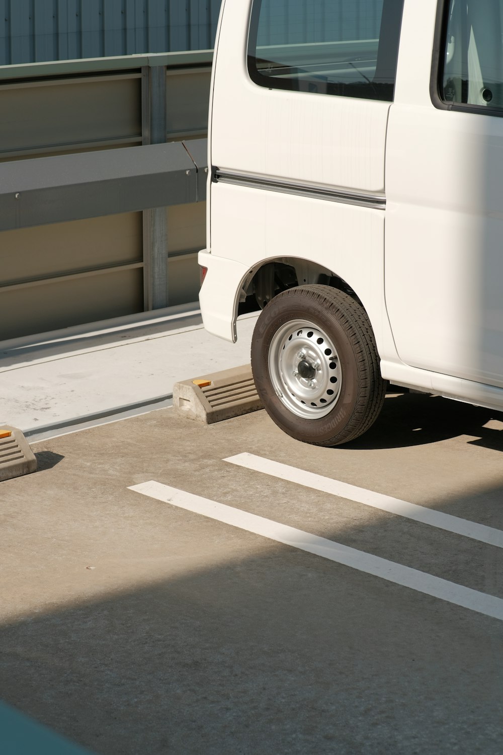 a white van parked in a parking lot