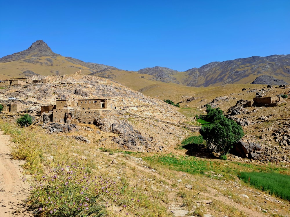 a dirt road in the middle of a mountain range