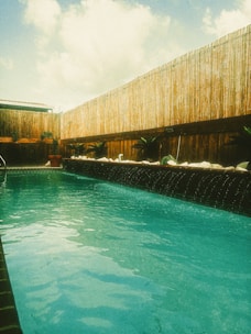 A safe and sturdy pool fence surrounding a private pool area in Bali.