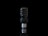 A modern, spiral-shaped light bulb is depicted against a black background. The bulb has a sleek, metallic finish with a reflective surface that catches light, emphasizing its clean and futuristic design. The compact fluorescent lamp is positioned vertically, showcasing its distinct coiled structure.