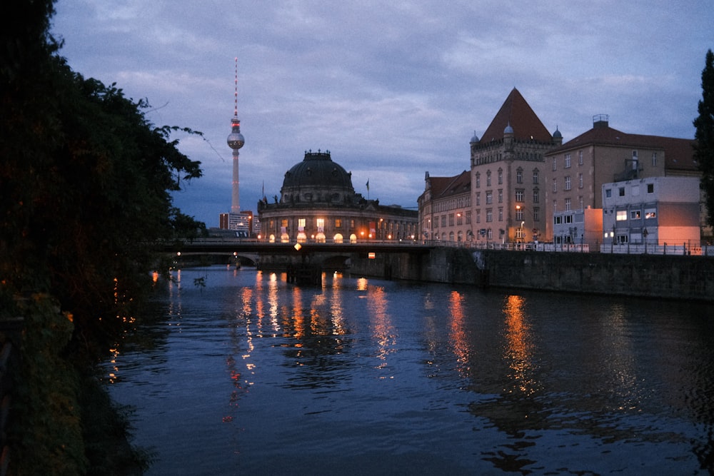 a river running through a city next to tall buildings