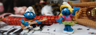 Illustration of charming characters interacting with musical instruments.