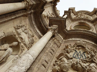 Visitors admiring the detailed Nativity façade, with its delicate carvings and lively figures.