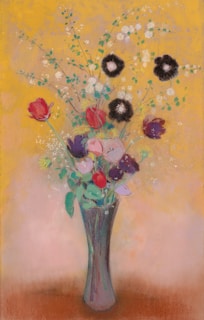 An acrylic still life painting of fresh flowers in a glass vase on a wooden table.