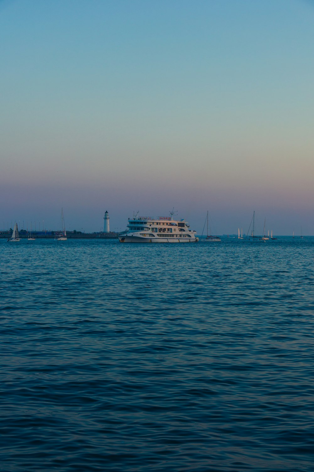 a large white boat floating on top of a large body of water