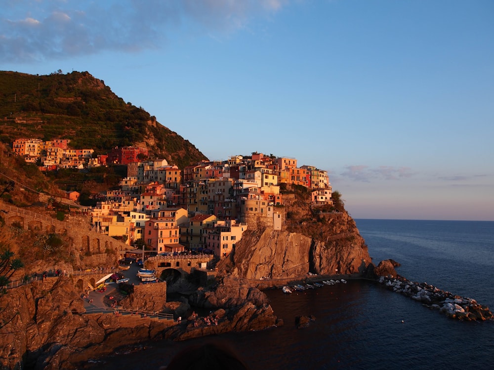 a small village on a cliff overlooking the ocean
