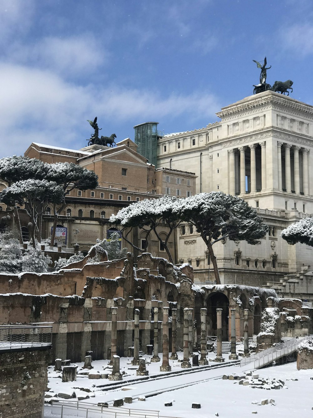 a large building with a statue on top of it