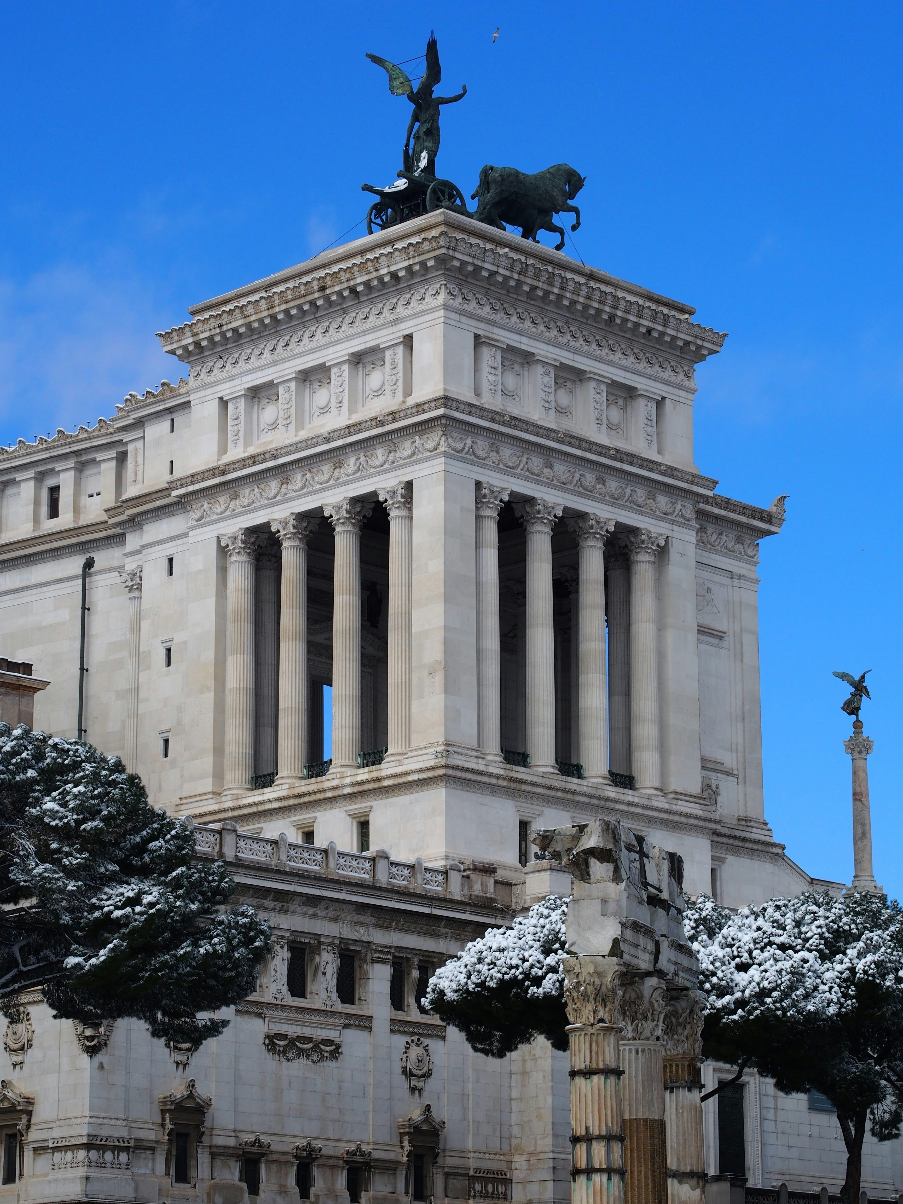 a building with a statue on top of it