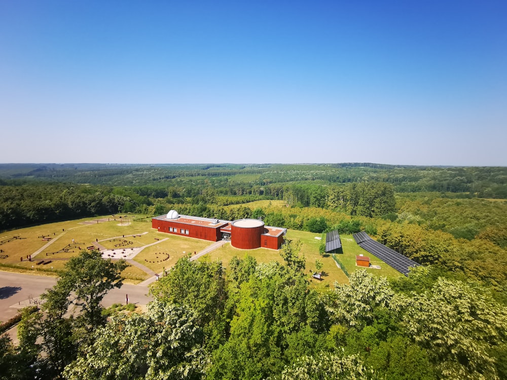an aerial view of a farm with a red barn