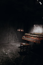 A serene room with pastel pink, purple, and blue tones equipped for one-on-one music therapy.