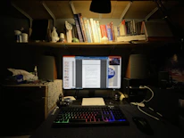 Close-up of legal books and documents on a minimalist desk with soft lighting.