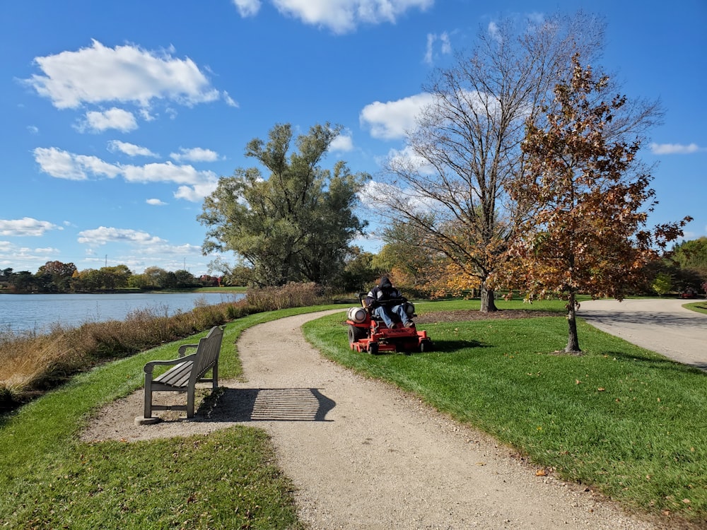 a park bench sitting next to a lake