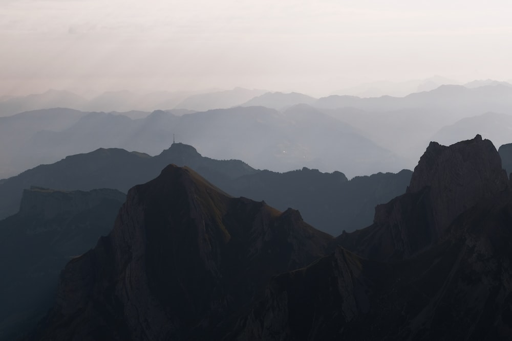 a mountain range with mountains in the distance