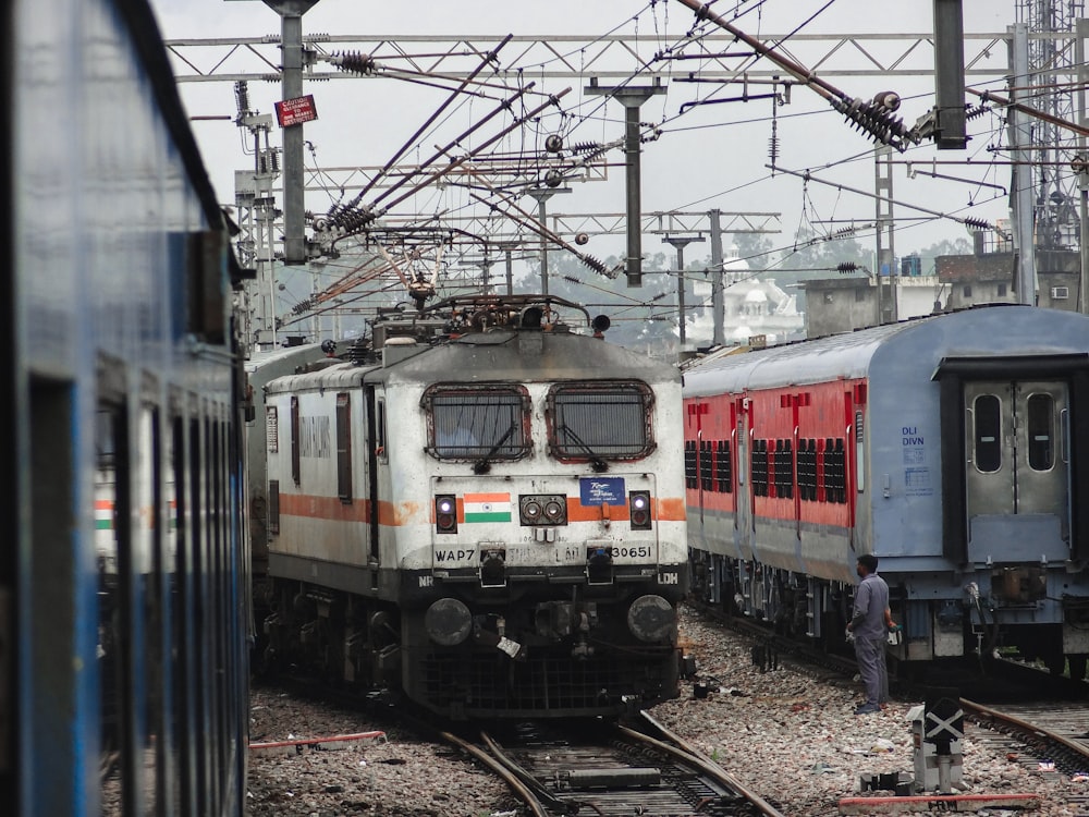 a couple of trains that are sitting on the tracks